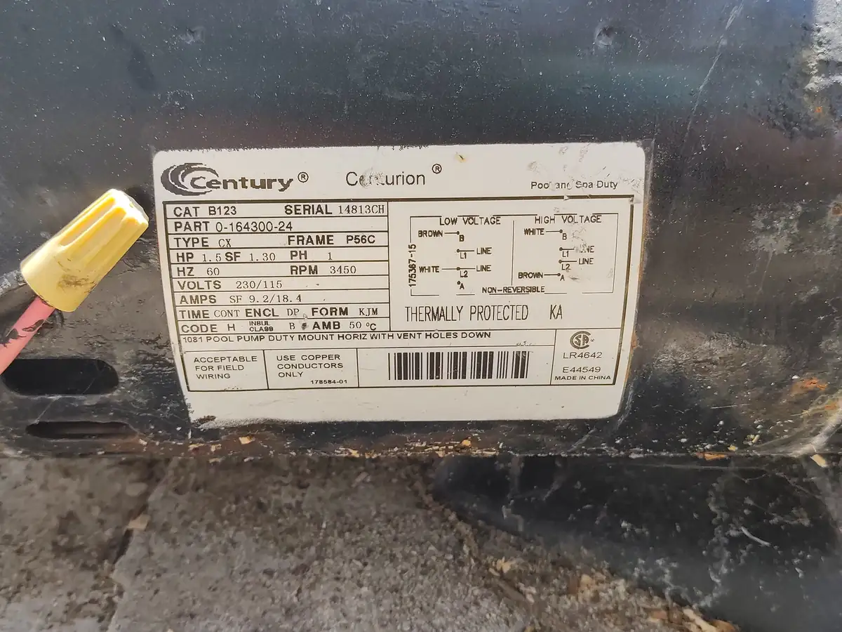 Century Centurion pool pump motor data plate photographed in the field, showing horsepower, voltage and serial number