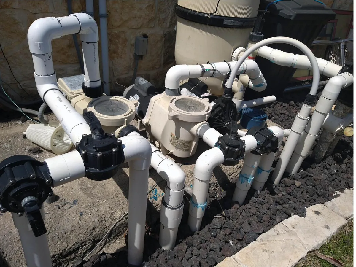 Freeze-damaged pool equipment documented during a claim inspection