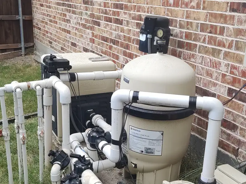 Pentair filter, heater and valve manifold on an equipment pad, photographed by Brian Lee Westfall during a Dallas–Fort Worth pool inspection